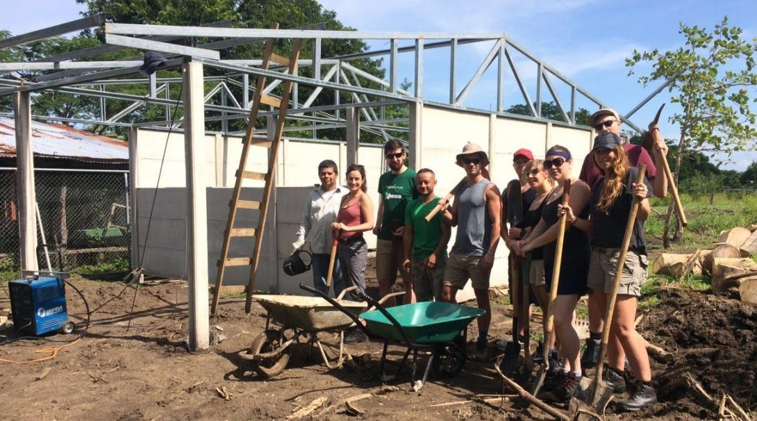 A tailor-made group trip in Costa Rica works on a building. Projects Abroad volunteers from a tailor-made group trip take a break while working on a Building project.